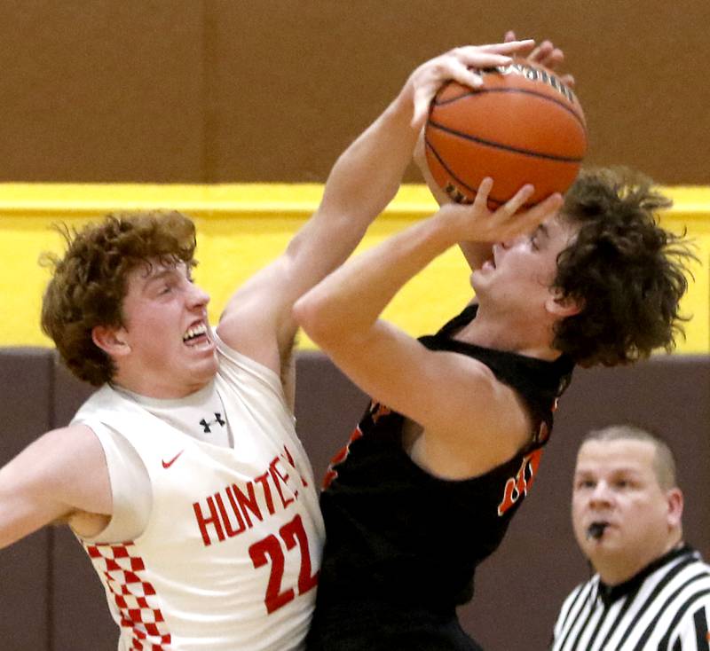 Huntley's Adam Guazzo blocks the shot of McHenry’s Anthony Fowler during a IHSA Class 4A Boys Regional basketball game Wednesday, Feb. 23, 2022, between Huntley and McHenry at Jacobs High School.