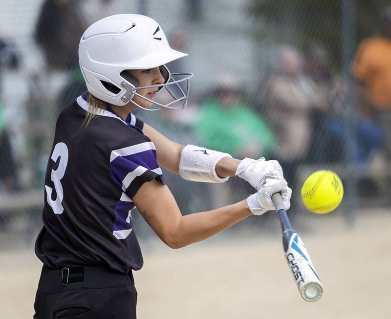 Dixon’s Addy Williams connects with a pitch against Rock Falls Thursday, May 7, 2026.