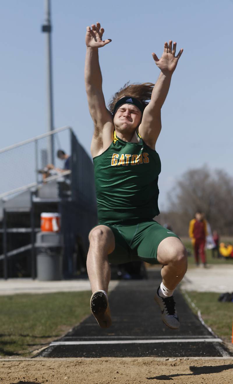 Crystal Lake South’s Nathan Van Witzenburg competes in the long jump Thursday, April 21, 2022, during the McHenry County Track and Field Meet at Richmond-Burton High School.
