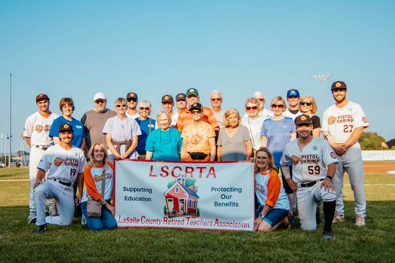 The La Salle County Retired Teachers Association gathered for a pre-game picture Thursday, July 25, with the Illinois Valley Pistol Shrimp.