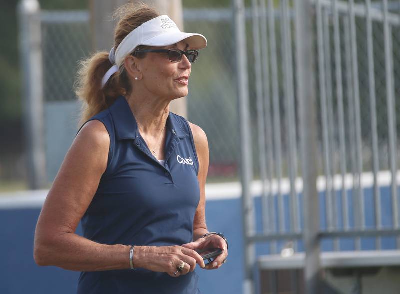 Fieldcrest cross country coach Carol Bauer watches runners as they race during the Gary Coates Cross Country Invitational on Saturday, Sept. 14, 2024 Zearing Park in Princeton.