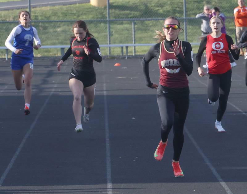 Morris's Ava Conley (center) wins the 400 meter run as Princeton's Lenora Hopkins, L-P's Kiera Mertes, and Ottawa's Kendall Justice trail behind during the Class 2A Sectional track meet on Wednesday, May 13, 2026 in the Jeff Prusator Athletic Complex at Mendota High School.