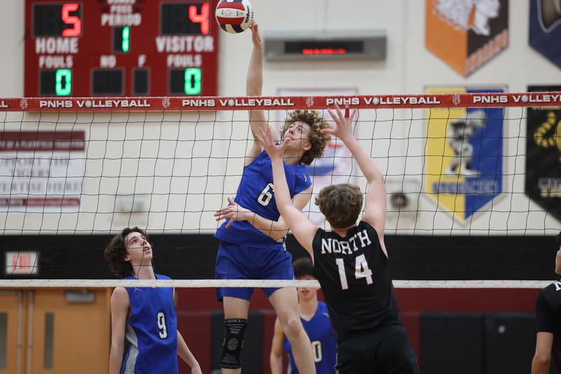 Lincoln-Way East’s Hunter Tabor goes up for the kill against Plainfield North on Tuesday, April 2, 2024.