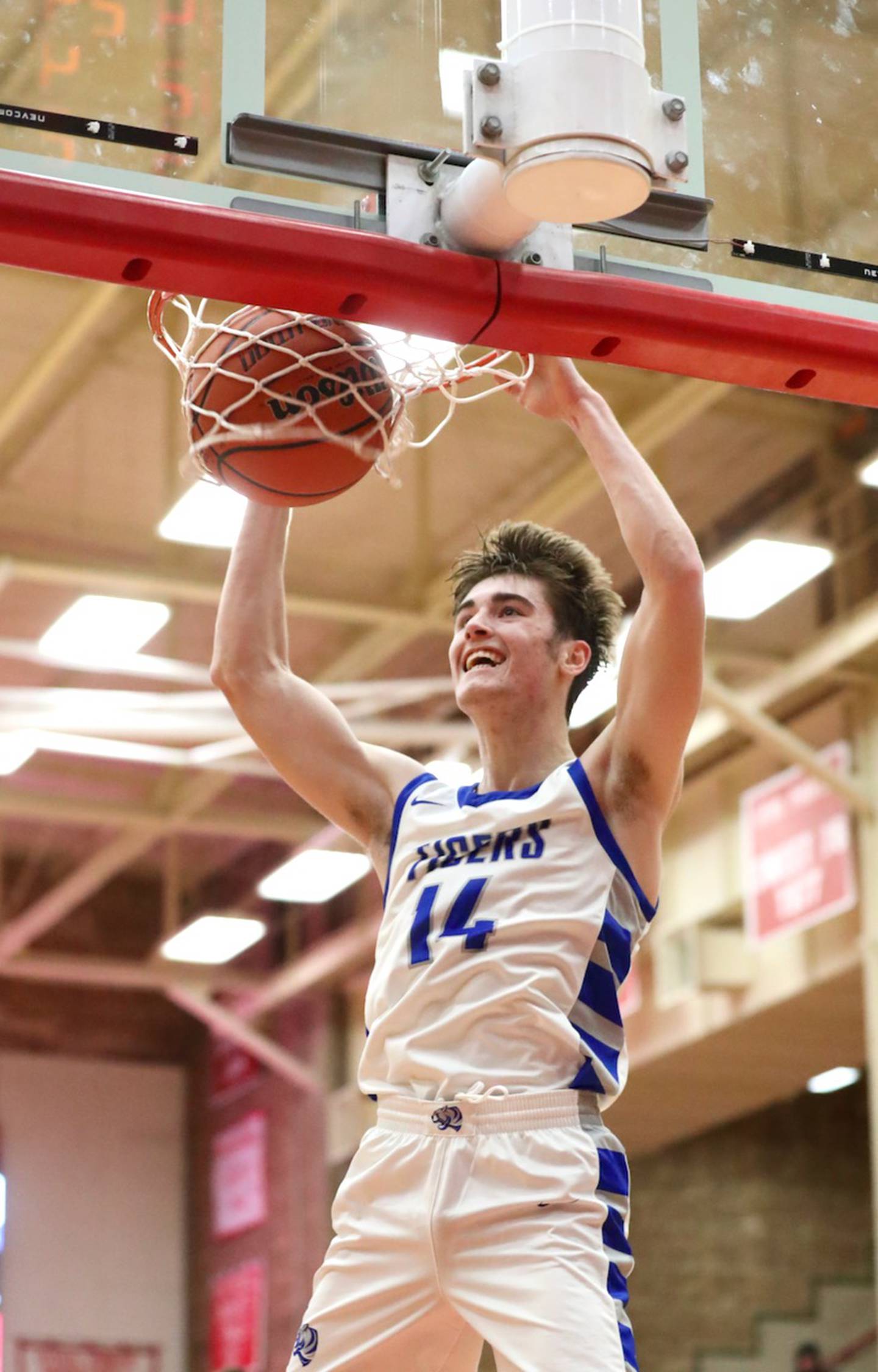 Princeton's Grady Thompson throws downs a dunk in Monday's win over Streator at Ottawa.