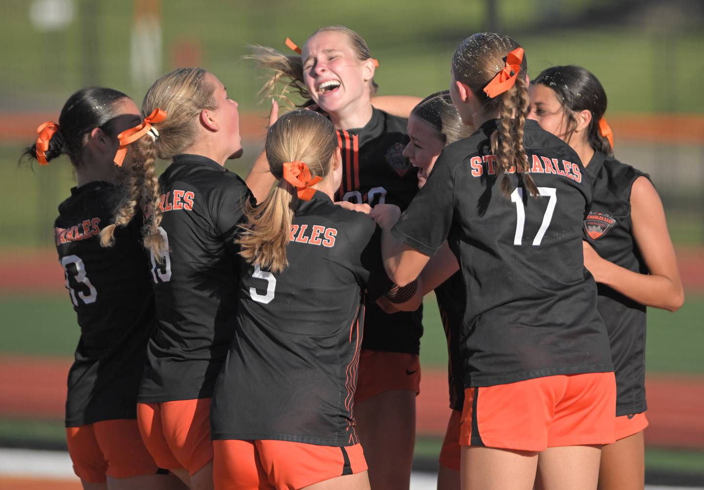 St. Charles East’s Maddie Sempsrott is surrounded by teammates after scoring the first goal against St. Charles North in the IHSA class 3A girls soccer sectional semifinal game in St. Charles on Tuesday, May 26, 2026.