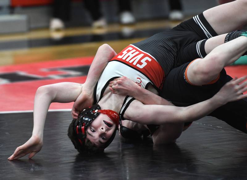 Stillman Valley's Carter Paulson tries to break free from Winnebago's Cam Whitehead  in the 108 championship match at the 1A Stillman Valley Sectional on Saturday, Jan. 31, 2026 at Stillman Valley High School.