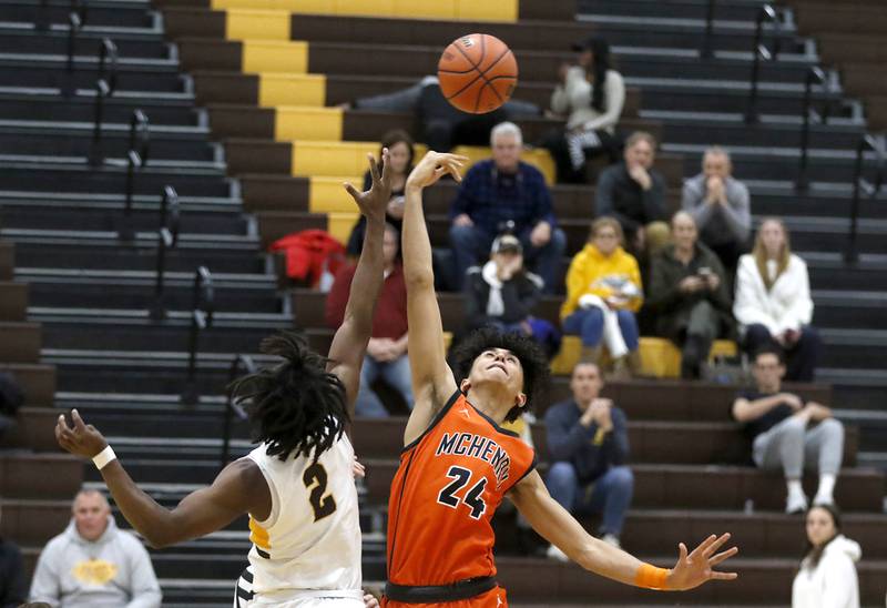 McHenry's Adam Anwar tips the ball away from Jacobs' Treval Howard during a Fox Valley Conference boys basketball game on Wednesday, Nov. 29, 2023, at Jacobs High School in Algonquin.