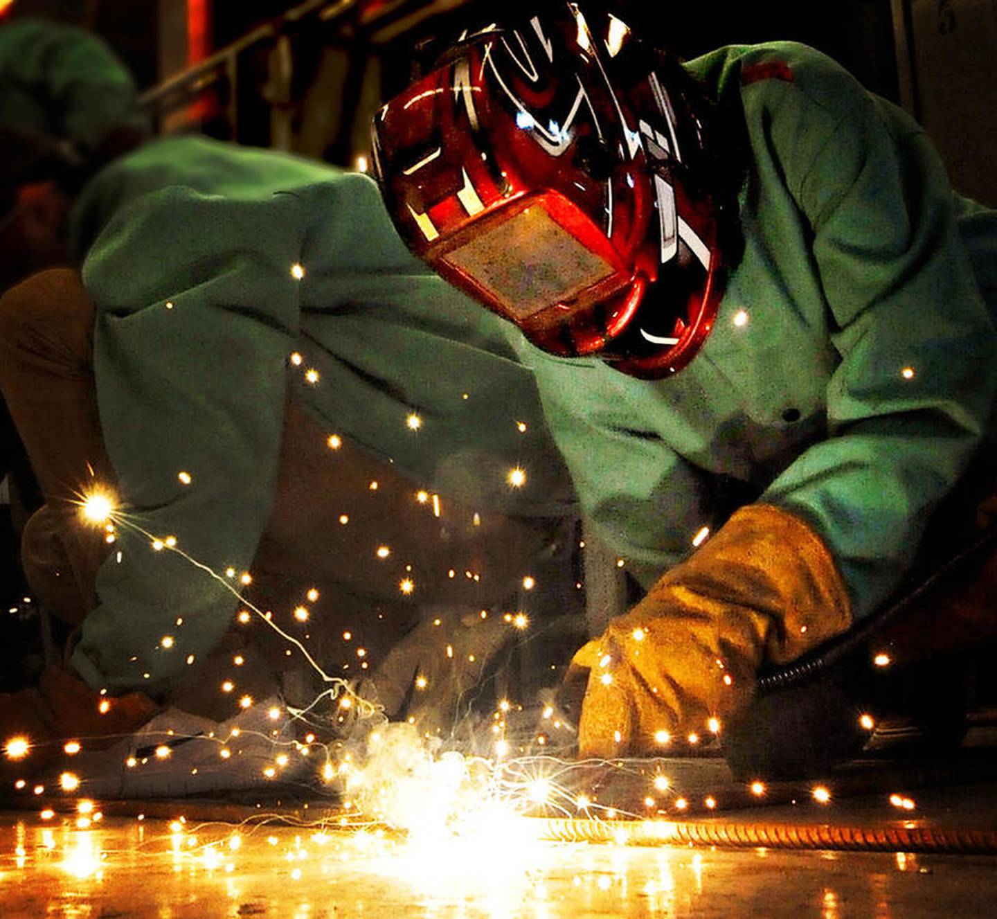 Streator High School junior Harley Hampton welds a supporting piece of rebar to a ship frame in David Taylor's welding class. The sculpture will be a part of Light Up Streator's decorations in City Park.