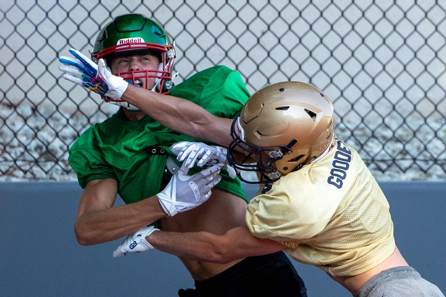 Jameson Hill of L-P gets pushed in helmet by Jacoby Gooden of Marquette during scrimmage on Tuesday July 16, 2025 at Howard Fellows Stadium in LaSalle.