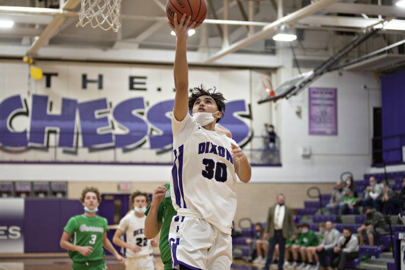 Dixon's Wyatt Wetzell puts up a shot against Geneseo Tuesday, Jan. 4, 2022.