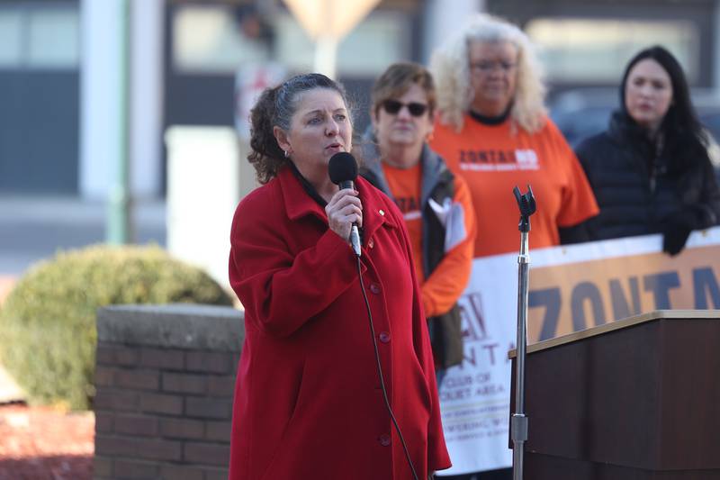 Guardian Angels Services Mary McGavin speaks during a rally for ZONTA Says No To Violence Against Women outside the old court house on Tuesday in Joliet.