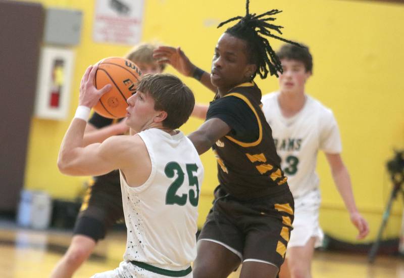 Jacobs’ Malachi Bell, right, pressures Grayslake Central’s Carson Woods in varsity boys basketball Hinkle Holiday Classic action on Tuesday, Dec. 23, 2025, at Jacobs High School in Algonquin.