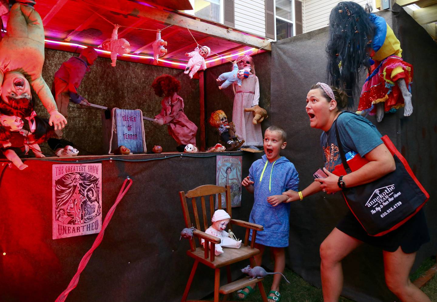 Wyatt and Jenna Caricato get freaked out at the Kamme-O-Circus Halloween Haunted House on Saturday, Oct. 19, 2024 in Elburn.