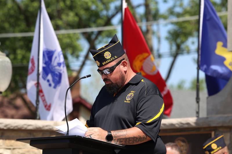 Corey Leddy, finance officer for the Bradley American Legion, reads the names of approximately 130 fallen service members from the Kankakee County area over the past year during the Legion's Memorial Day ceremony on Monday, May 25, 2026.
