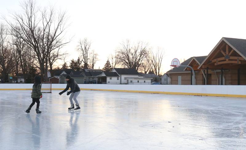 An aerial view of skaters skating on the ice on Thursday, Dec. 5, 2024 at Washington Park in Peru.