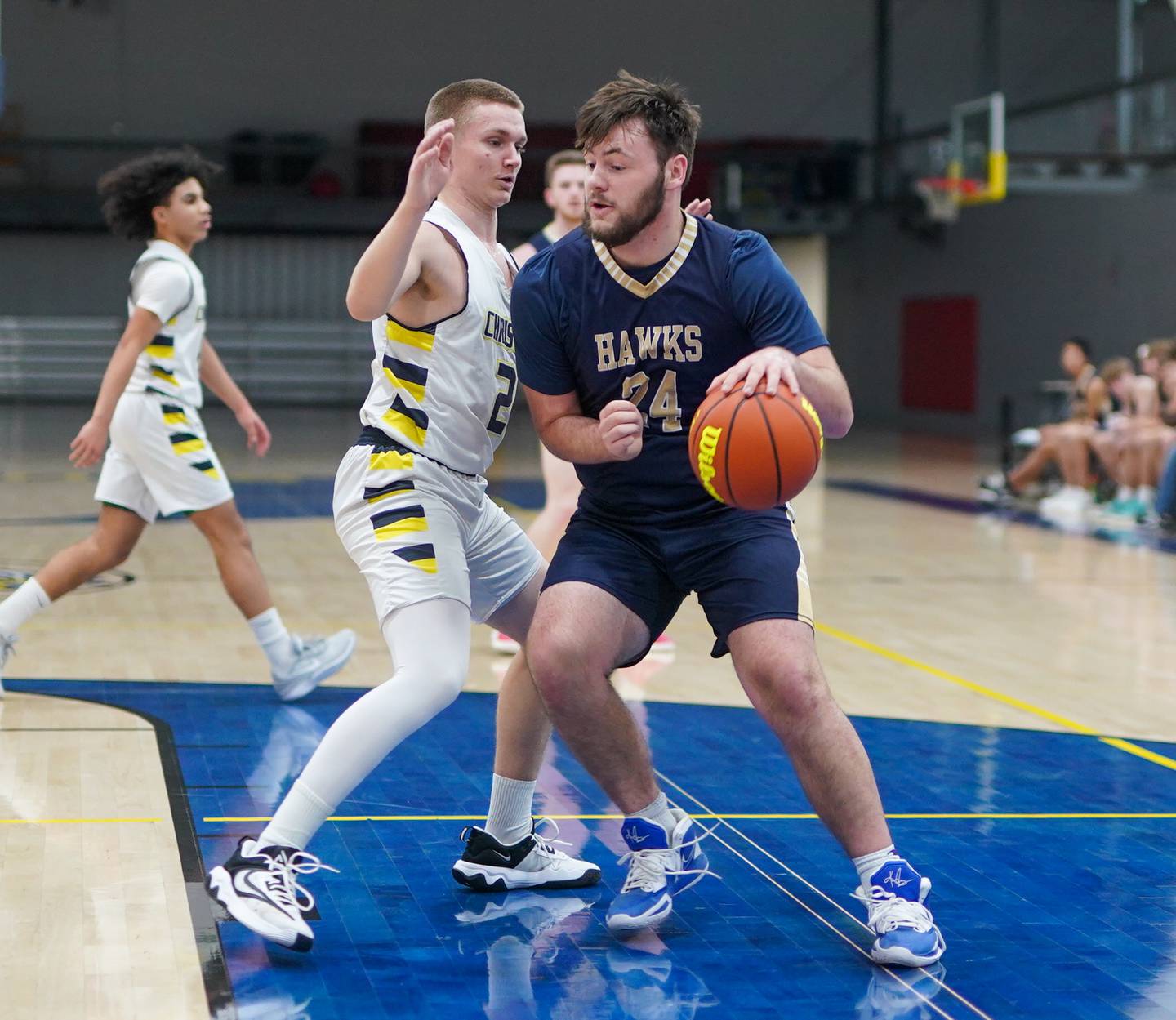Hiawatha's Zachary Edwards (24) posts up against Yorkville Christian's Brady Sovern (2) during a basketball game at Yorkville Christian High School in Yorkville on Friday, Jan 5, 2024.