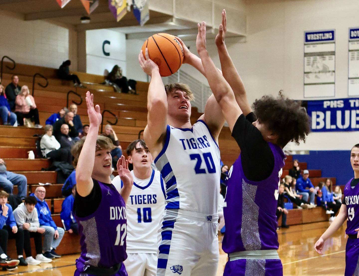Princeton's Arthur Burden shoots over Dixon's Darius Harrington Monday night at Prouty Gym. The Dukes won 61-50.