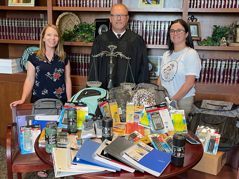 (Left to right): Lee, Ogle and Whiteside counties Regional Office of Education family support specialist Jessica Faivre, 15th Judicial Circuit Judge Clay Lindsey and Regional Office of Education family and community services coordinator Diana Merdian participating in a statewide initiative to prepare students for the upcoming school year