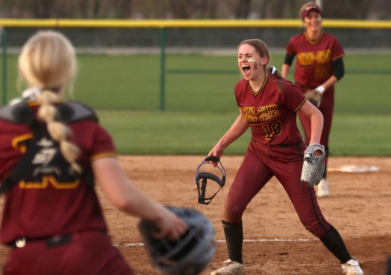 Richmond-Burton pitcher Hailey Holtz howls with delight after the final out of an extra-inning win in varsity softball at Marengo Wednesday evening.