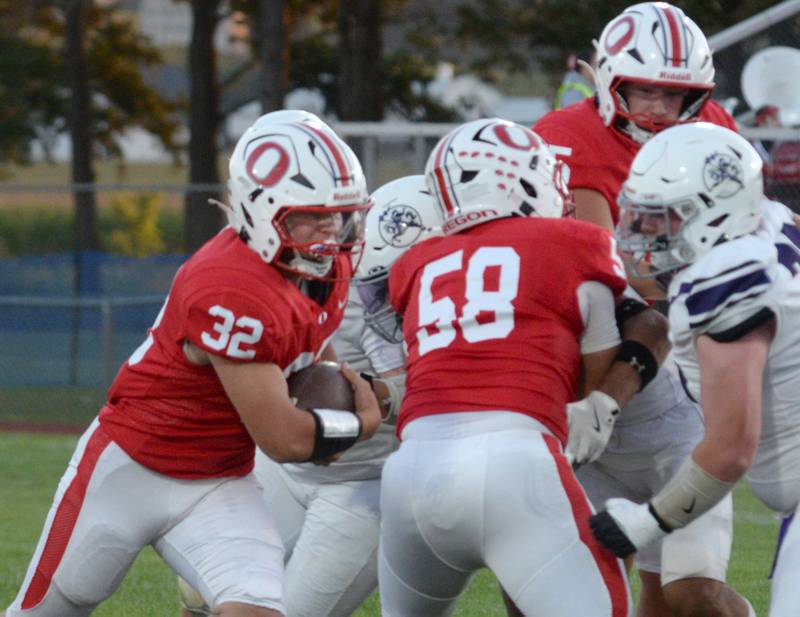 Oregon's Jakob Moser (32) runs with the ball against Rockford Lutheran on Friday, Sept. 5, 2025 at Landers-Loomis Field in Oregon.