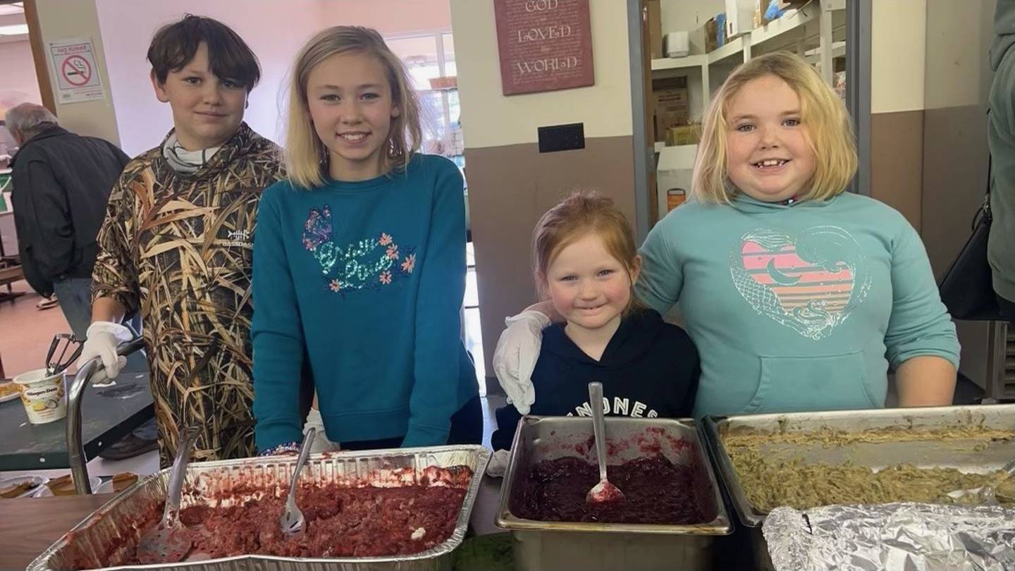 Nick Wilkins, of Shorewood, Ellie Wilkins, of Shorewood, Lucy Obodzinski, of Seneca and Addy Wilkins of Shorewood serve Thanksgiving dinner on Wednesday at A Servants Heart.