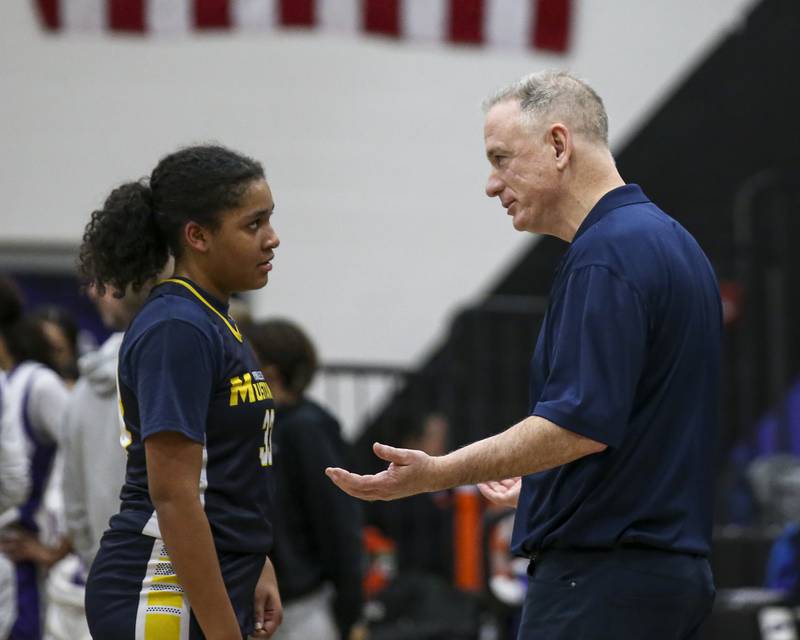 Yorkville Christian's head coach John McAdams talks to Kiana Ogulie (33) during a stoppage in play in their basketball game between Yorkville Christian at Plano Wednesday, Jan 07, 2026 in Plano.