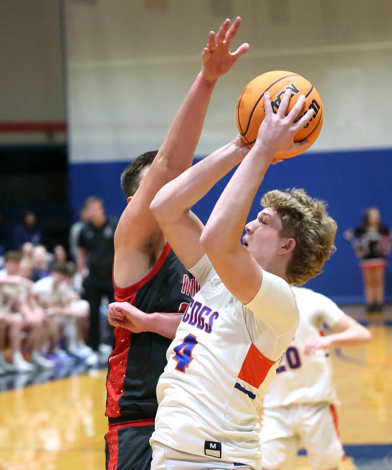 Genoa-Kingston's Cody Cravatta goes to the basket against an Indian Creek defender during their game Friday, Jan. 2, 2026, at Genoa Kingston High School.