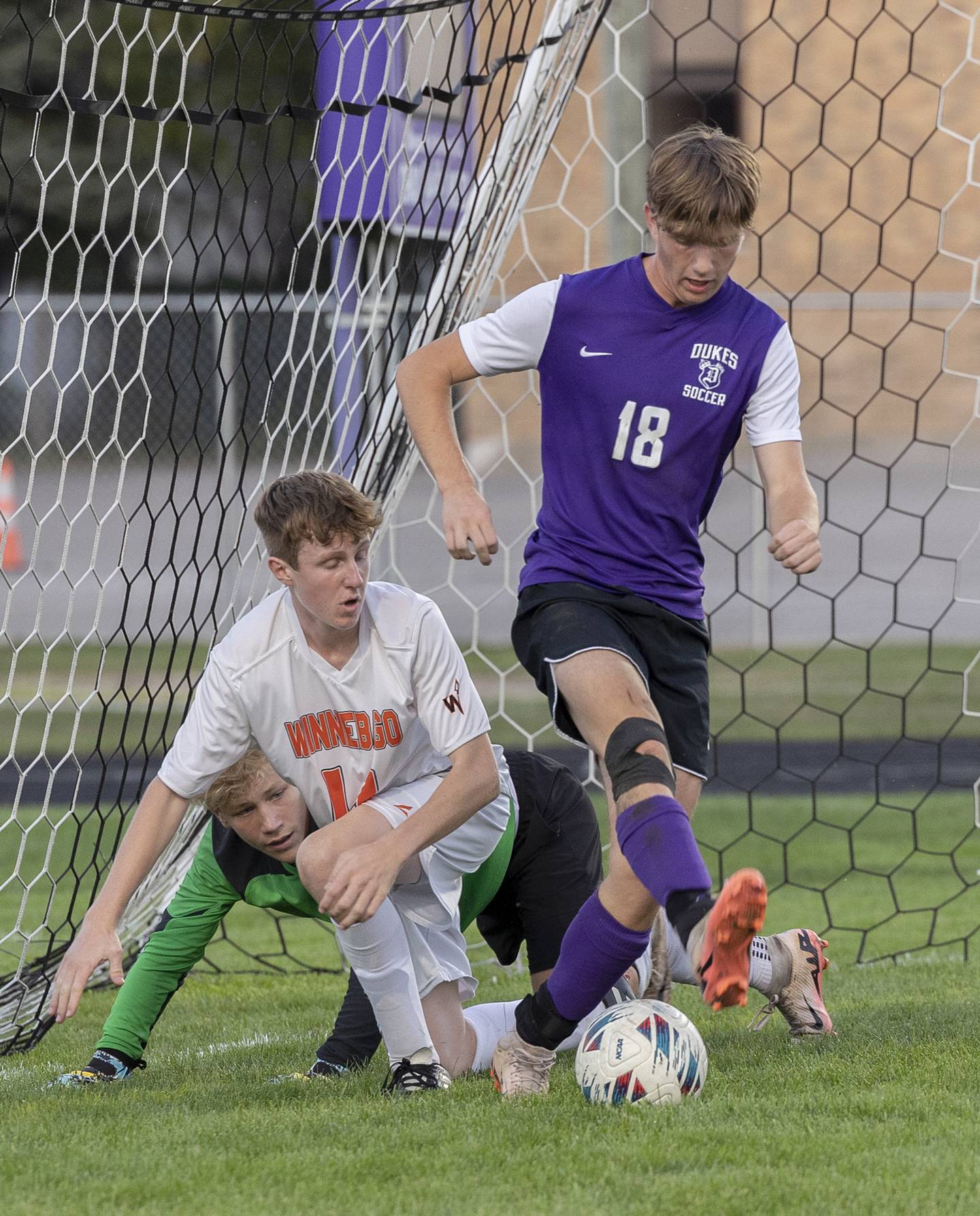 Dixon’s Ethan Bond back kicks at a ball in front of the Winnebago goal Thursday, Sept. 26, 2024, at Dixon High School.
