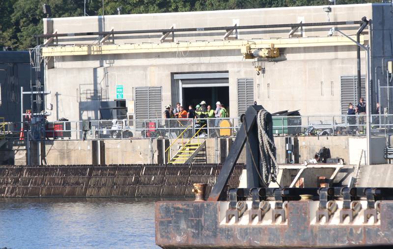 Fire crews work the scene of a fire at the Starved Rock hydroelectric power plant at the Starved Rock Lock and Dam on Tuesday, Oct. 3, 2023 near Utica. A MABAS box alarm was sent out just before 730a.m. for a working fire inside the plant.