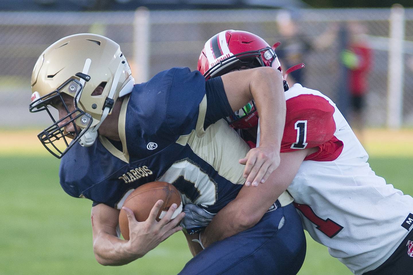 Polo’s Avery Grenoble is tackled by Amboy’s Kyle Koch Friday, Aug. 26, 2022.
