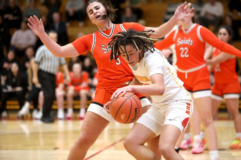 Batavia’s Addie Prewitt goes after the ball trailed by St. Charles East’s Lexi DiOrio during a game at Batavia on Thursday, Feb. 1, 2024.