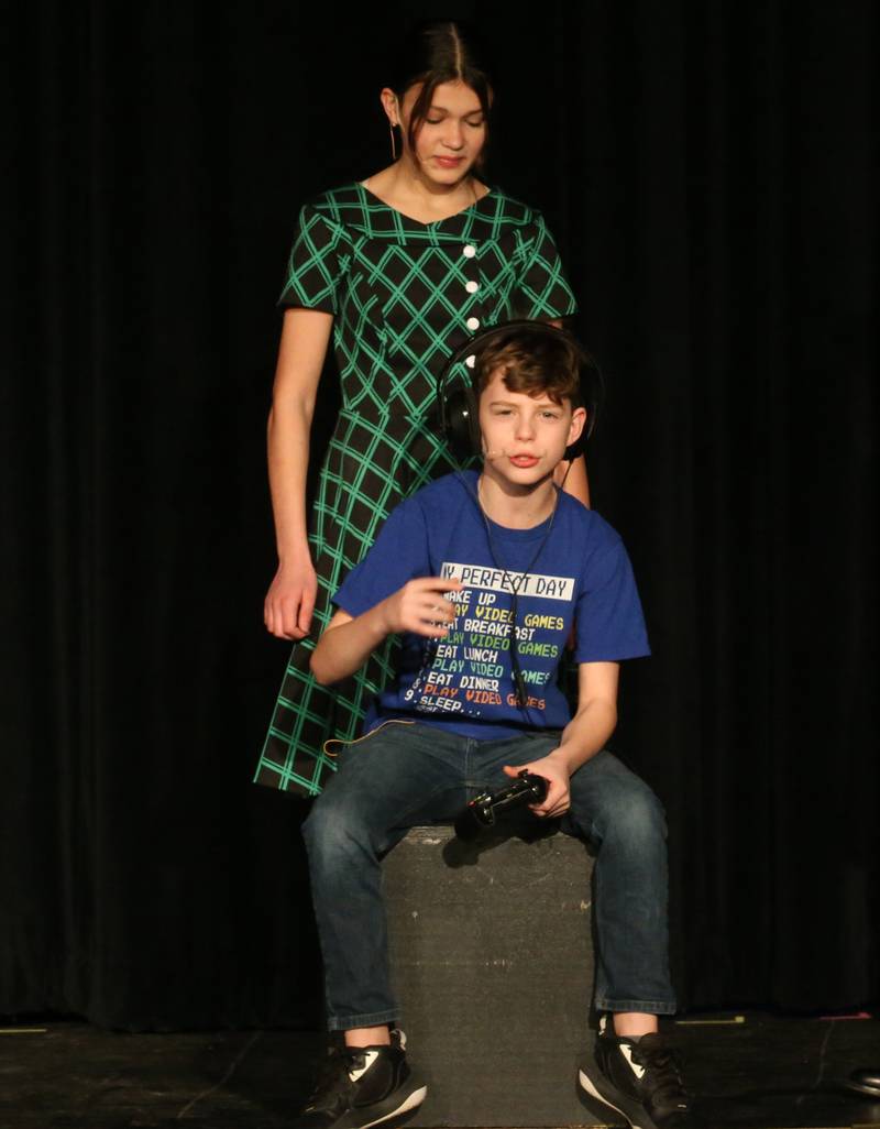 Mrs. Teavee, played by Ella Schrowang and Mike Teavee, played by Sawyer Smith, act out a scene during a performance of Willy Wonka on Thursday, March 16, 2023 at Putnam County High School.