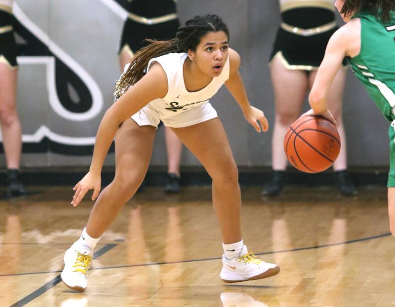 Sycamore's Monroe Mcghee plays defense against Providence Catholic's Kelly Knight during their game Tuesday, Feb. 22, 2022, in the Class 3A Kaneland sectional in Maple Park.