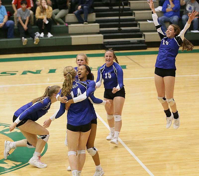 Members of the Newark volleyball team celebrate after defeating Putnam County in the Class 1A semifinal game on Wednesday, Oct. 16, 2022 at St. Bede Academy in Peru.