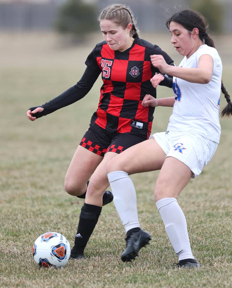 Indian Creek's Alexa Anderson (left) and Genoa-Kingston's Yuliza Fuentes fight for possession during their game Thursday, March 16, 2023, at Pack Park Sports Complex in Waterman.