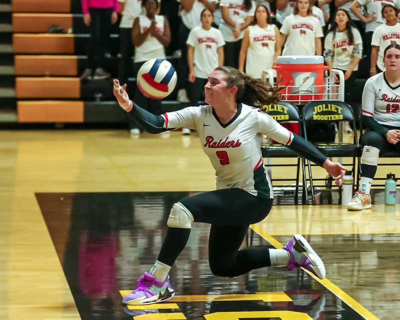 Bolingbrook's Noelle Aprati (9) tries a desperate save to prevent the match point during regional final volleyball match between Bolingbrook at Joliet West.  Oct 26, 2023.