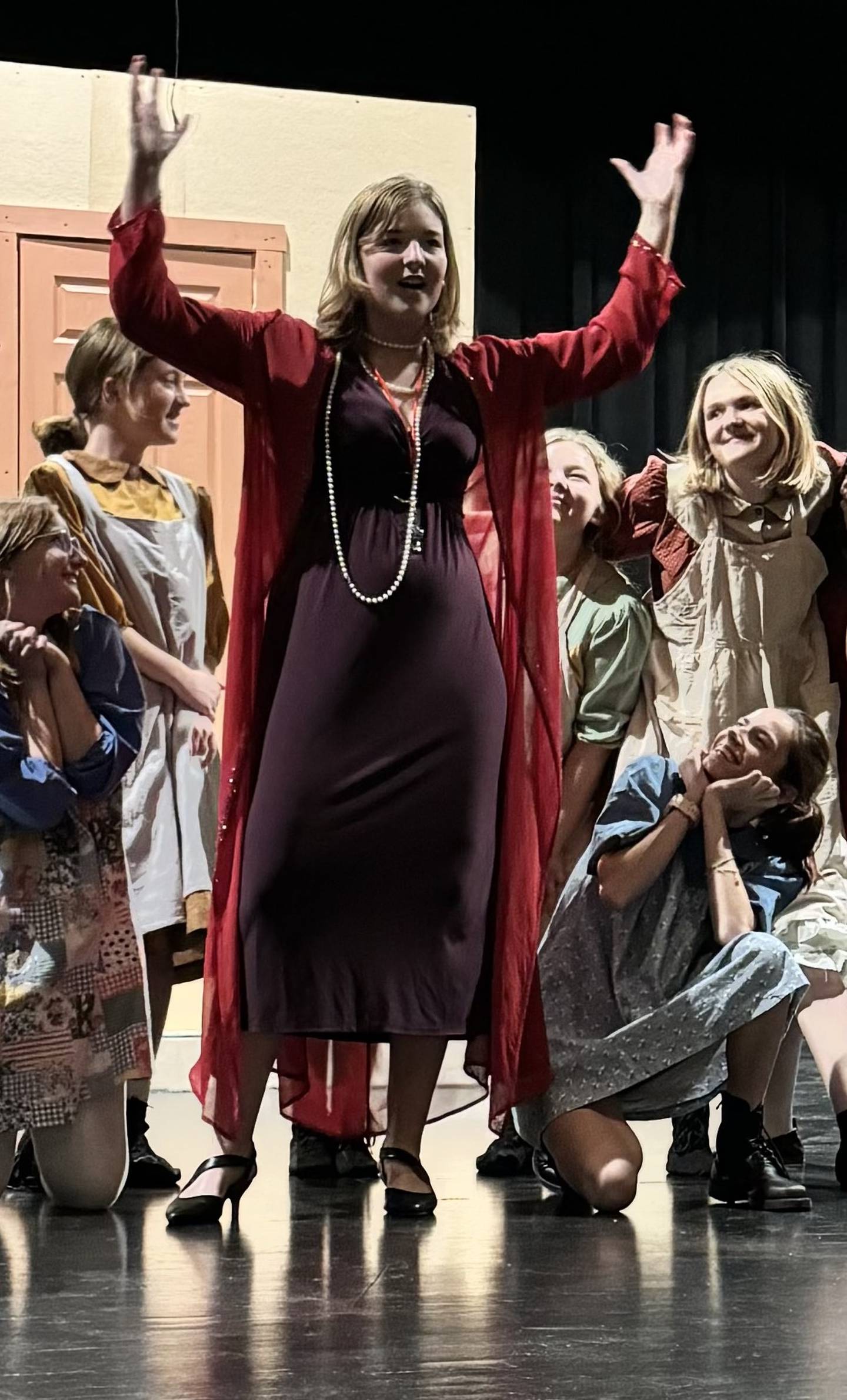 Sadie Johnson rehearses a scene portraying Miss Hannigan with the orphans in Ottawa High School's performance of "Annie."
