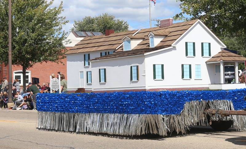 A replica of the Lovejoy Homestead home makes it's way down South Main Street during the 54th annual Homestead Festival parade on Saturday, Sept. 6, 2025 in Princeton.