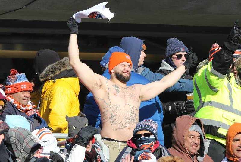 A Bears fan shakes off the cold to cheer on his team against the Buffalo Bills Sunday, Dec. 24, 2022, at Soldier Field in Chicago.