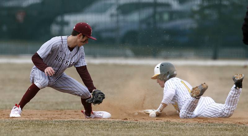 Crystal Lake South’s Dayton Murphy safely slides into second base after Richmond-Burton’s Ryan Junge lost the ball during a nonconference baseball game Friday, March 24, 2023, at Crystal Lake South High School.