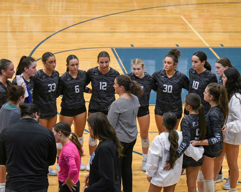 St. Francis's head coach Lisa Ston talks to the team during a break in the action on Wednesday Oct. 2, 2024, while taking on St. Charles North held at St. Francis High School in Wheaton.