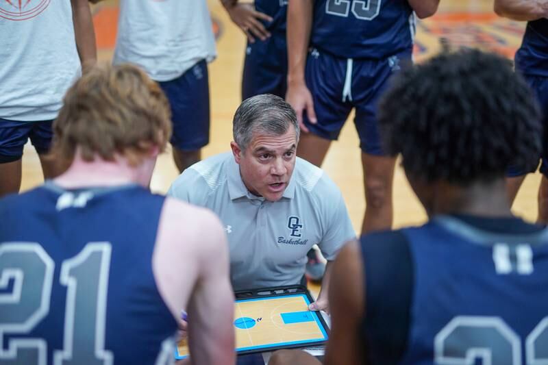 Oswego East's head coach Ryan Velasquez talks to his players during a hoops for healing basketball tournament game against Neuqua Valley at Oswego High School on Friday, Nov 24, 2023.