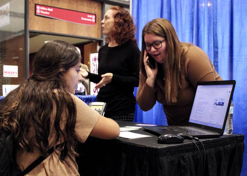 Renzije Dzeladini, 13, of Morrison runs through an exercise on how to verify a job applicant's status, assisted by two Verfacts employees. Vanessa Wessels, engagement director, left, and Shaunte Padilla, a performance specialist, guided Dzeladini through the verification process central to Sterling firm's role within the financial industry. The activity was part of the Pathway Playground career exploration fair held Friday, Oct. 14, 2022, at Sauk Valley Community College.