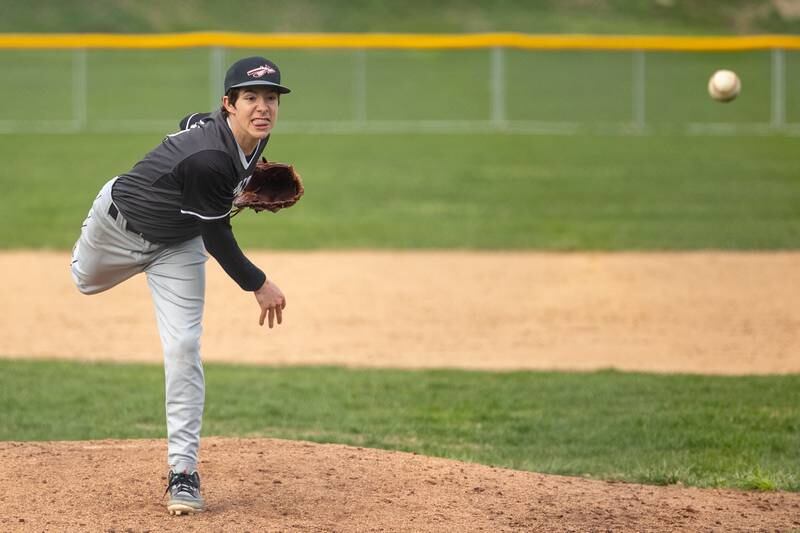 Reece Pelnarsh (21) of Streator/Woodland pitches on Thursday, April 10, 2025 at St. Bede High School in Peru.