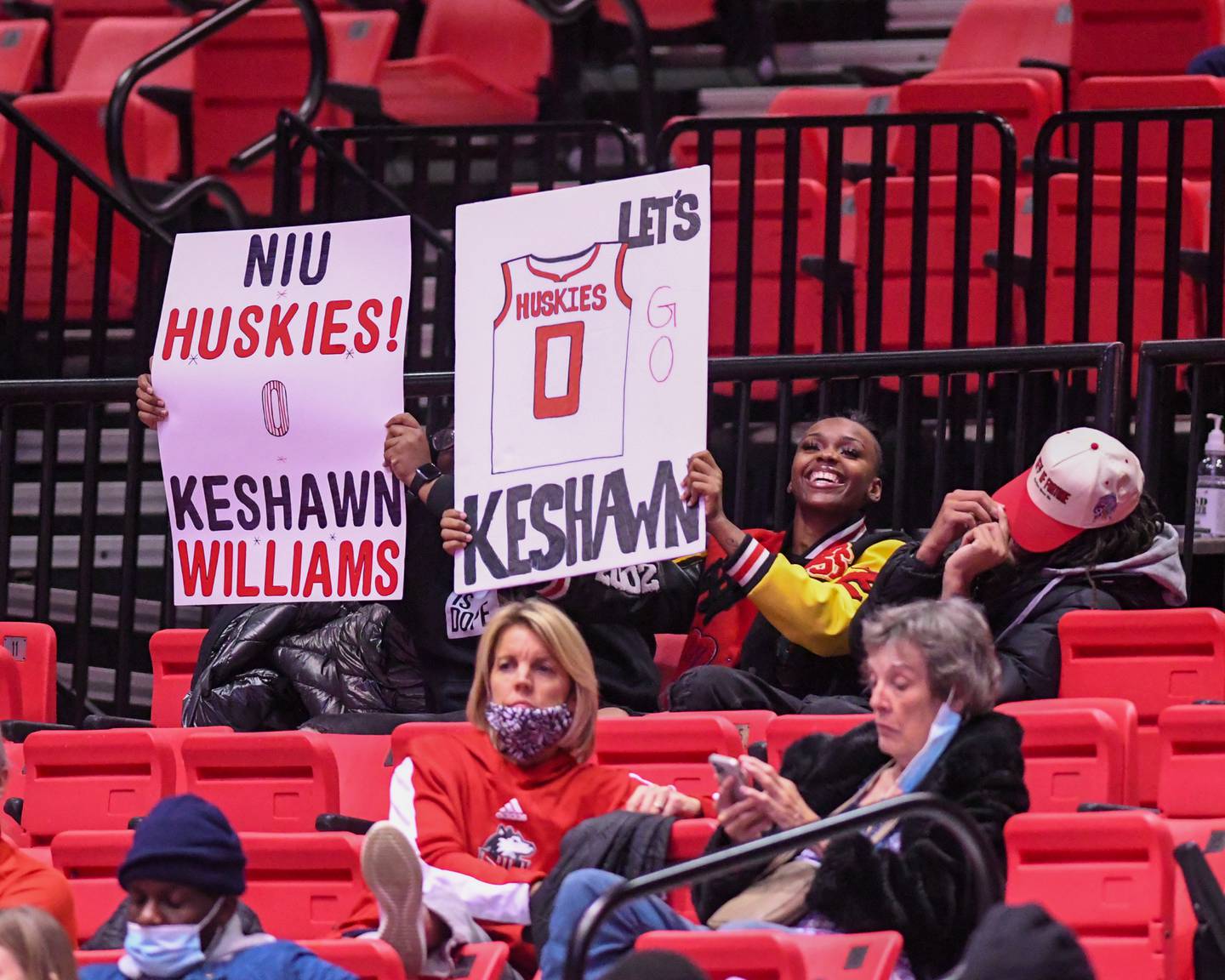 Some fans of NIU guard Keshawn Williams shy away as others hold signs that were shown on the jumbotron during the first half of the game on Tuesday Dec. 1st while taking on Eastern Illinois.
