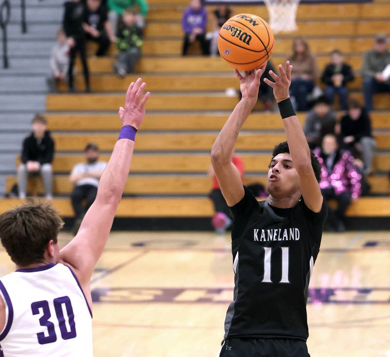 Kaneland's Evan Frieders shoots over Rochelle's Warren Schwietzer Tuesday, Feb. 3, 2026, in their game at Rochelle High School.