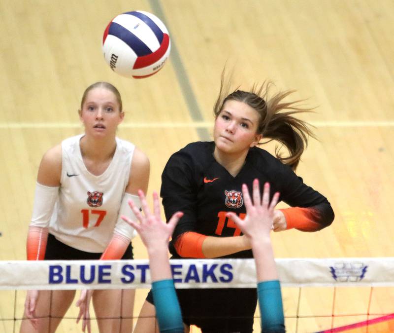 Crystal Lake Central’s Jordyn Johnson, right, sends the ball over the net against Woodstock North in IHSA girls volleyball Class 3A Regional action at Woodstock High School in Woodstock on Thursday, October 30, 2025. Tessa Popp, left, keeps her eyes on the action.