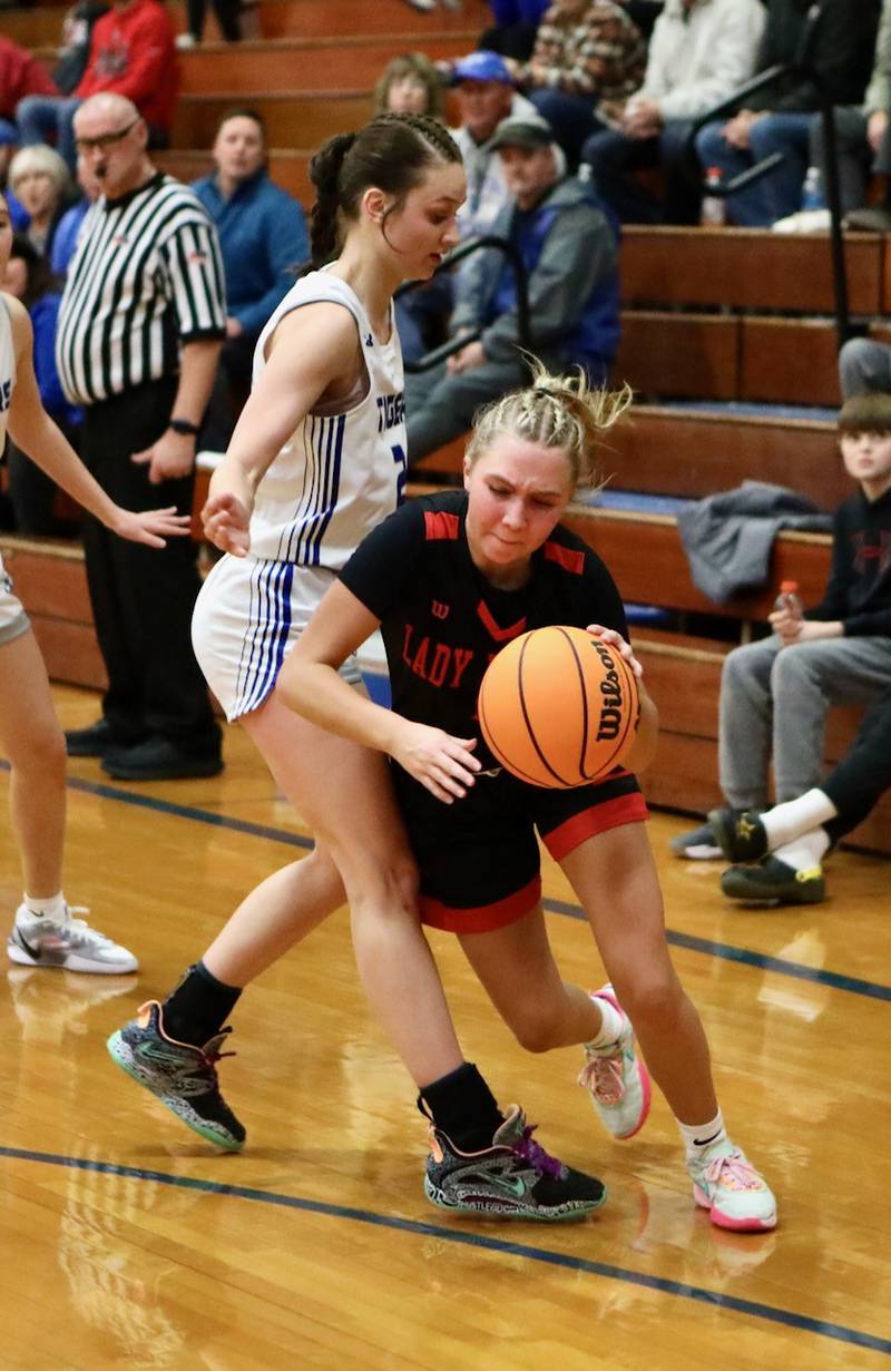 Hall's Charlie Pellegrini tries to get past Princeton's Keighley Davis Thursday night at Prouty Gym. The Tigresses won 34-30.