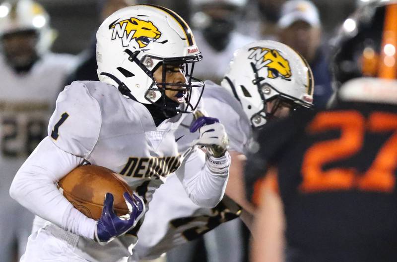 Neuqua Valley's Jaden McGee carries the ball during their game against DeKalb Friday, Oct.14, 2022, at DeKalb High School.