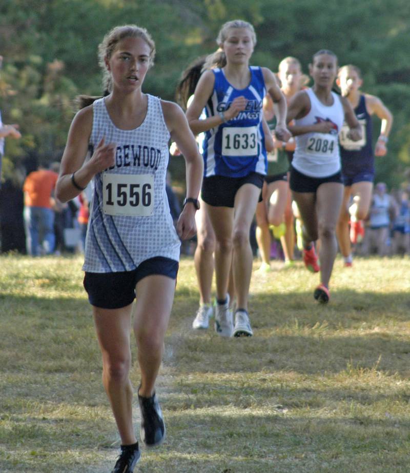 Emily Downing leads the pack of girl Cross Country runners. Local High School teams gathered at Hoover Park in Sterling for the Rock River Run, held on Saturday, September 27, 2025.